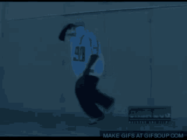 a person 's feet are visible in a dark room and the word rikudo is on the screen
