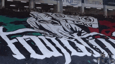 a large black and white flag with the word elmax on the bottom