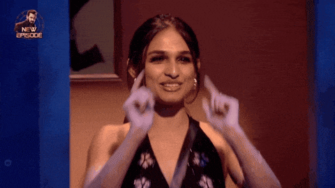a woman in a black dress and white gloves is making a funny face with the words new episode above her