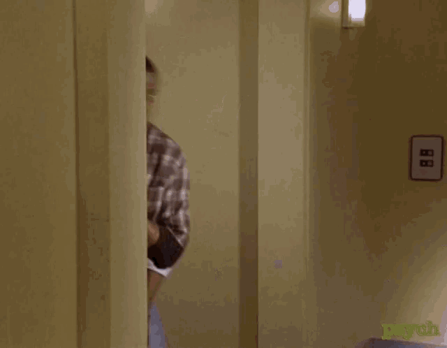 two men peeking out from behind a door with the word psych on the bottom