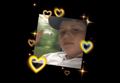 a boy in a hat is surrounded by hearts and stars