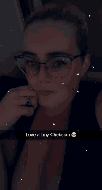 a woman wearing glasses and a ring has the words love all my chebsian above her