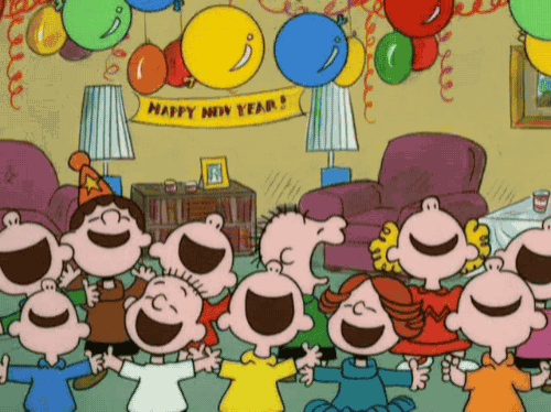 a cartoon of peanuts celebrating the new year with balloons and a banner that says happy new year