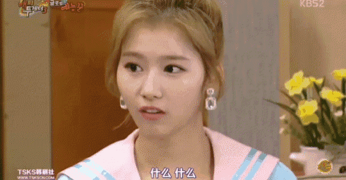 a close up of a woman 's face with the number kbs2 on the bottom left