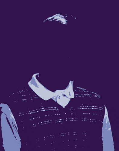 a man wearing a plaid vest and a white shirt is screaming