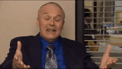 a man in a suit and tie is talking to someone