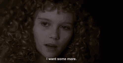 a woman with curly hair is saying i want some more