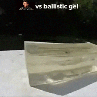 a block of ballistic gel is sitting on a table with a man in the background