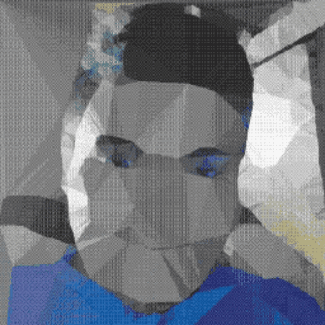 a pixelated image of a man with a blue shirt on