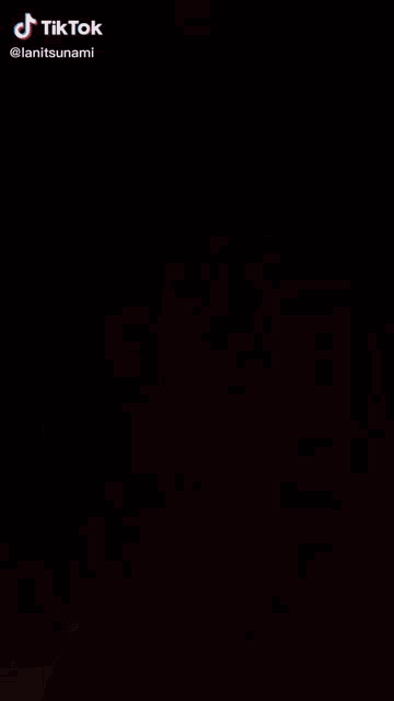 a close up of a person 's face with tiktok written on the bottom right
