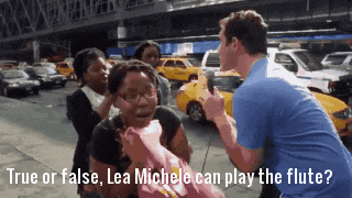 a man in a blue shirt is asking if lea michele can play a flute