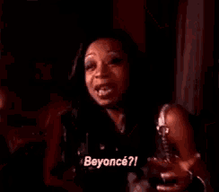 a close up of a woman 's face with her mouth open and the words beyonce ? written on it .