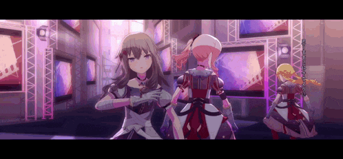 a group of anime girls are standing next to each other in front of a stage .