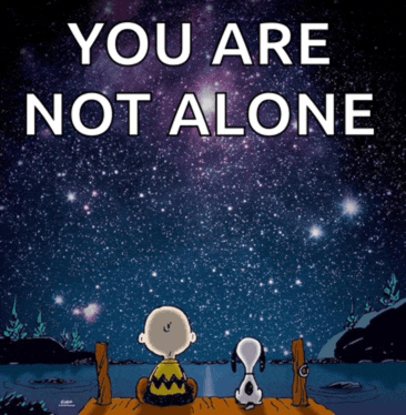 charlie brown and snoopy sitting on a dock looking at the stars