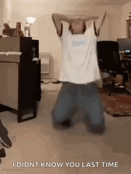 a man is kneeling down in a room with his arms in the air and says `` i didnt know you last time ''