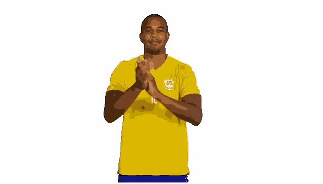 a man in a yellow shirt has the number 10 on his chest