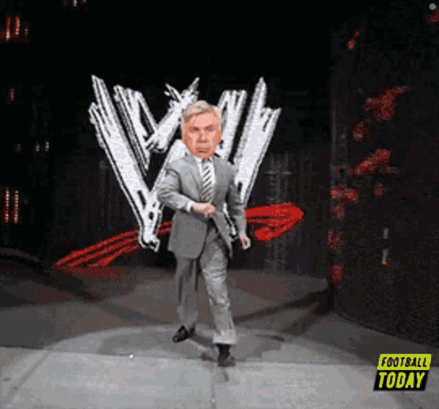 a man in a suit and tie is dancing on a stage in front of a sign that says football today