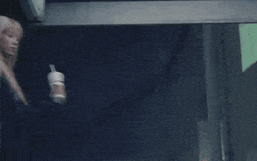 a person is walking down a set of stairs with a metal railing