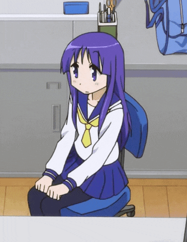 a girl with purple hair is sitting in a chair