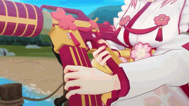 a girl is holding a gun with flowers on it