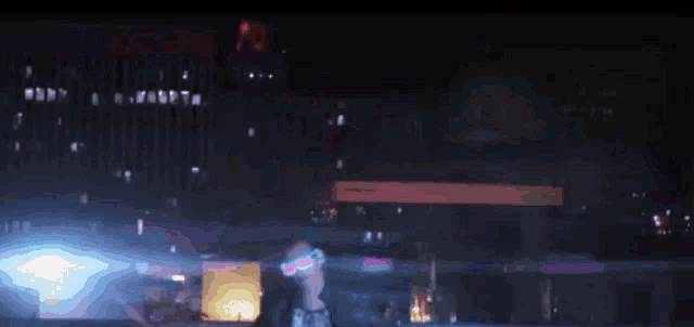 a woman wearing sunglasses is dancing in front of a city skyline