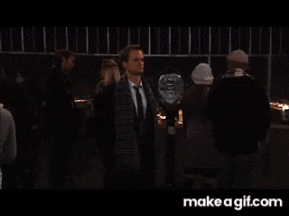 a man and a woman are standing next to each other on a make a gif.com website