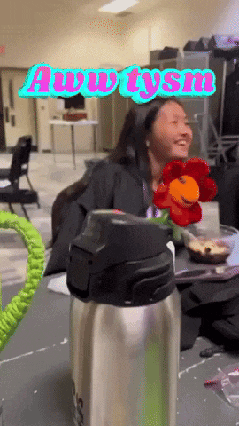 a girl holding a flower with the words aww tysm above her