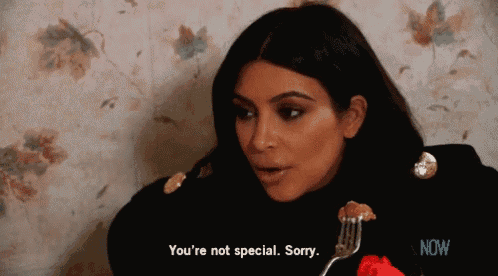 a woman is holding a fork in her hand and says you 're not special sorry