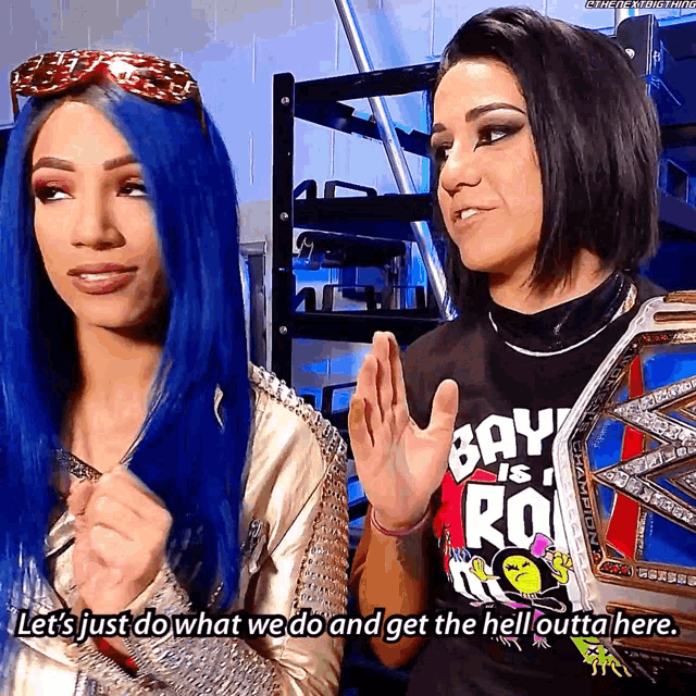 two women standing next to each other with one wearing a shirt that says bay is roo