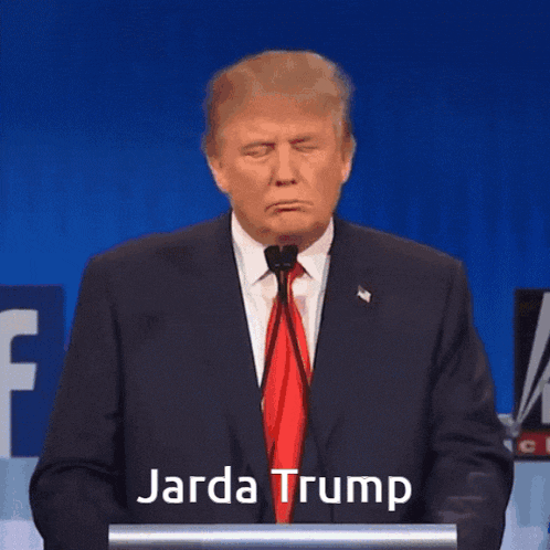 a man in a suit and tie is standing at a podium with jarda trump written on it