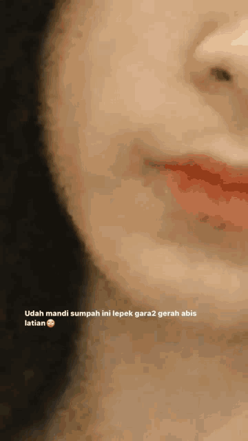 a close up of a woman 's face with the caption udah mandi sumpah ini