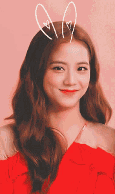 a woman in a red dress with bunny ears on her hair