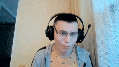 a man wearing headphones with a microphone on his head