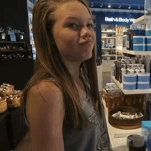 a girl in a bath and body works store