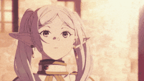 a close up of a girl with pigtails and a collar around her neck