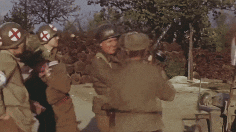 a group of soldiers wearing red crosses on their sleeves
