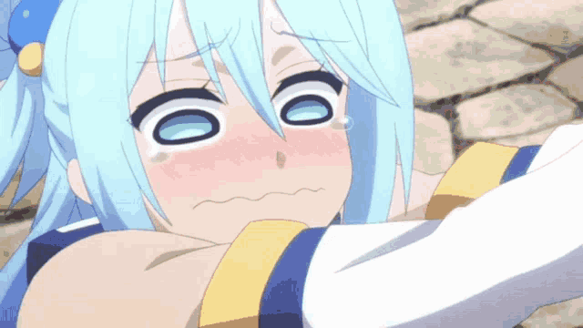 a girl with blue hair is making a funny face with her eyes closed