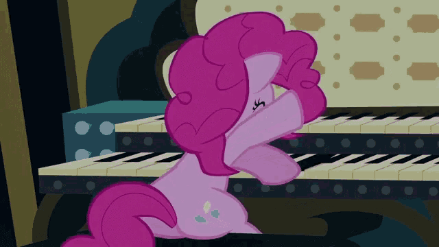 a pink pony is playing a piano with her eyes closed