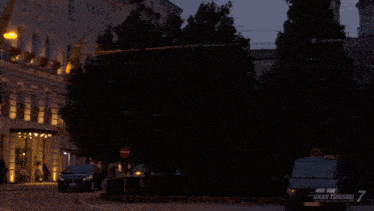 a black car with a license plate that says ' gran turismo 7 ' on it