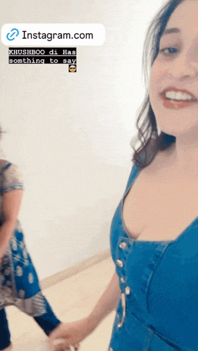 a woman in a blue dress is holding someone 's hand with instagram.com at the bottom of the image