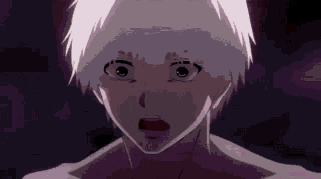 a close up of a person 's face with a shocked look on their face .