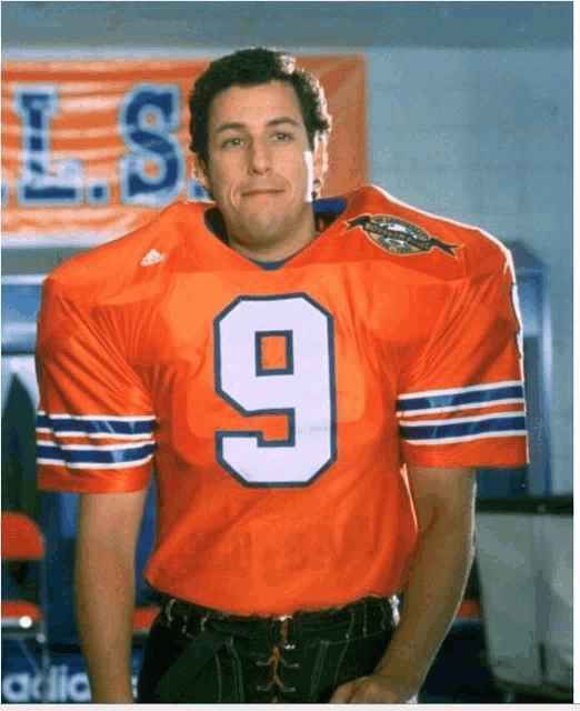 a man in an orange jersey with the number 9