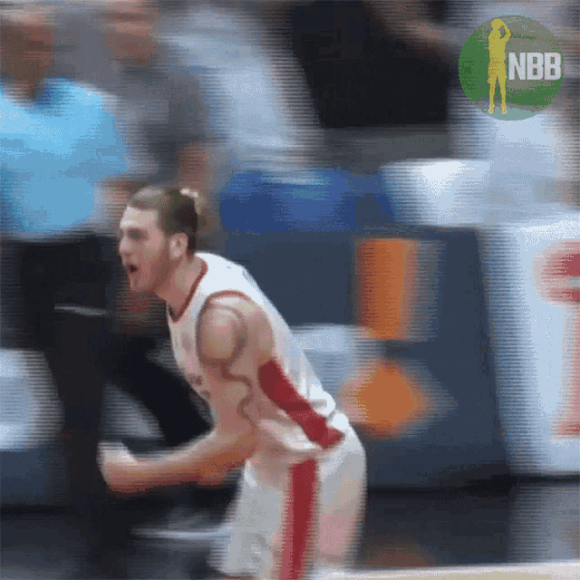 a blurry picture of a basketball player with a nbb logo in the corner