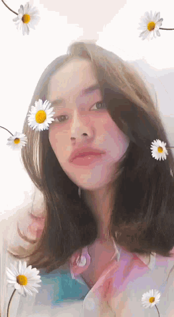 a woman is surrounded by daisies on her face