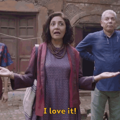 a woman says i love it while standing in front of a group of people