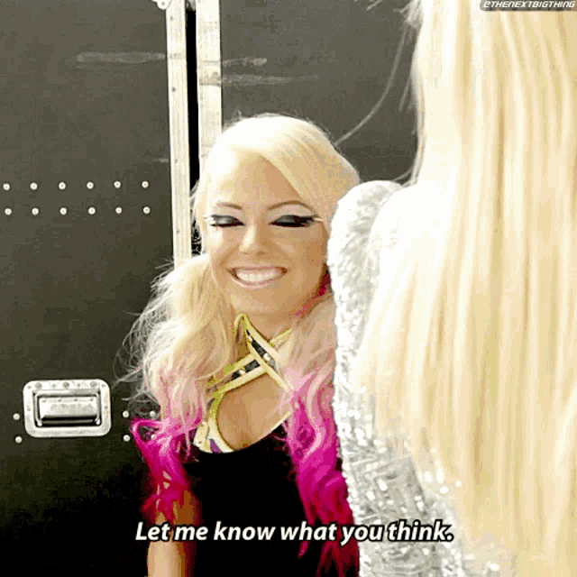 a blonde woman with pink hair is smiling and says let me know what you think