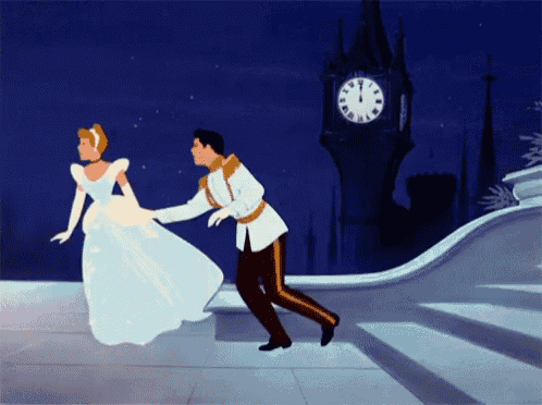 cinderella and prince charming dancing in front of a clock tower