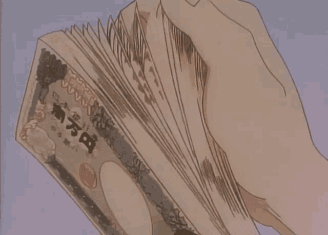 a person is holding a stack of money with the number 1000 on it