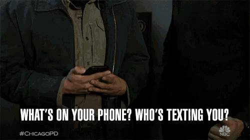 two men are looking at a cell phone and the caption says what 's on your phone who 's texting you