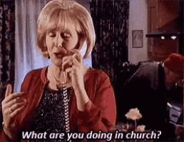a woman is talking on a cell phone and asking what are you doing in church .